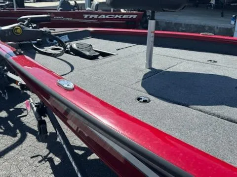 Slide: The Image of 2025 Tracker Pro Team 175 boat, red exterior, spacious deck, fishing equipment visible. - 7