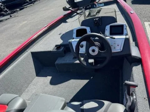 Slide: The Image of 2025 Tracker Pro Team 175 boat interior with steering wheel and dual displays. - 9