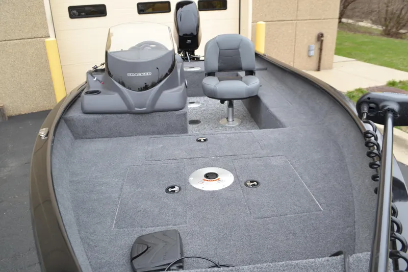 Slide: The Image of 2025 Tracker Super Guide V-16 SC fishing boat interior with seating and control console. - 4