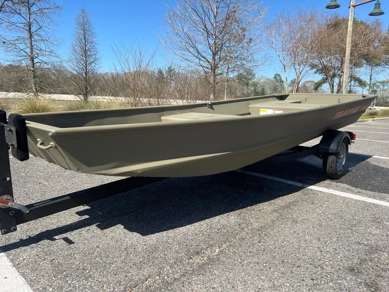 Slide: The Image of 2025 Tracker Grizzly 15 Jon boat on trailer in parking lot. - 3