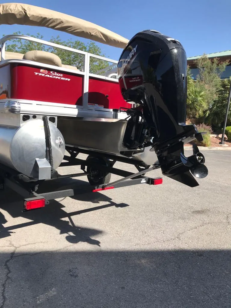 Slide: The Image of 2025 Sun Tracker Bass Buggy 18 DLX pontoon boat with powerful outboard motor. - 5
