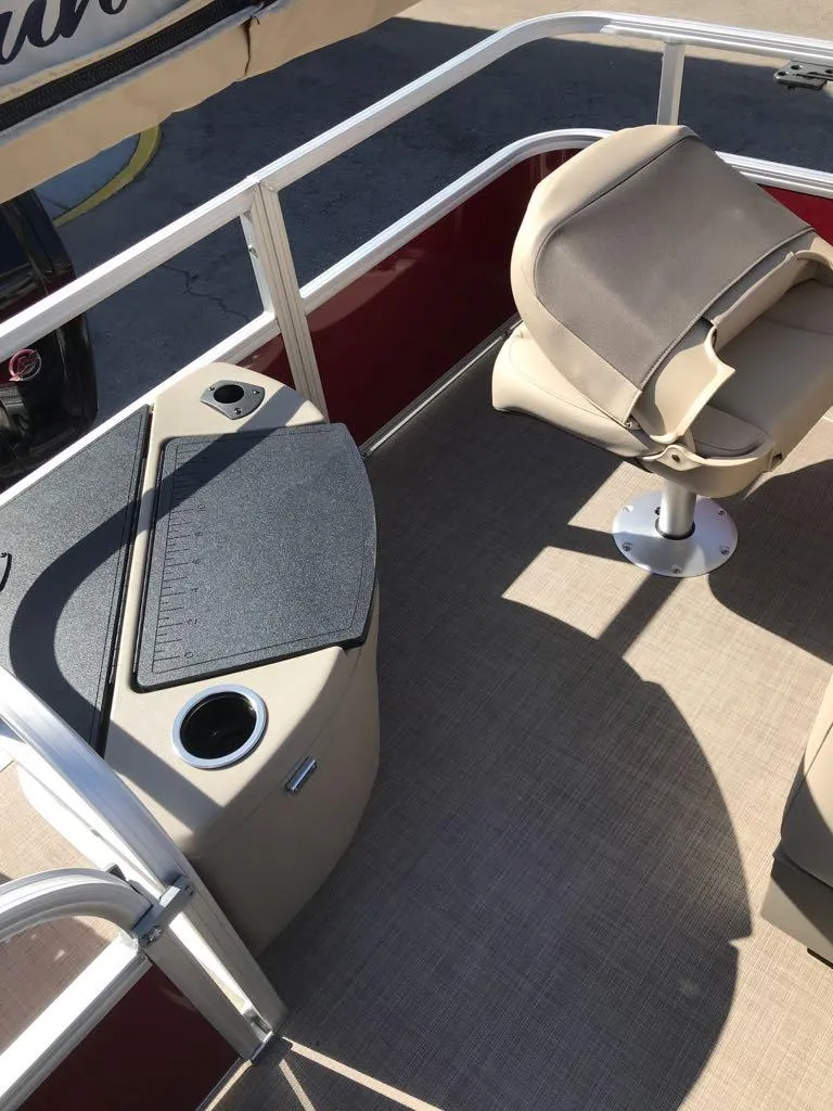 Slide: The Image of 2025 Sun Tracker Bass Buggy 18 DLX interior with seating and console details. - 8