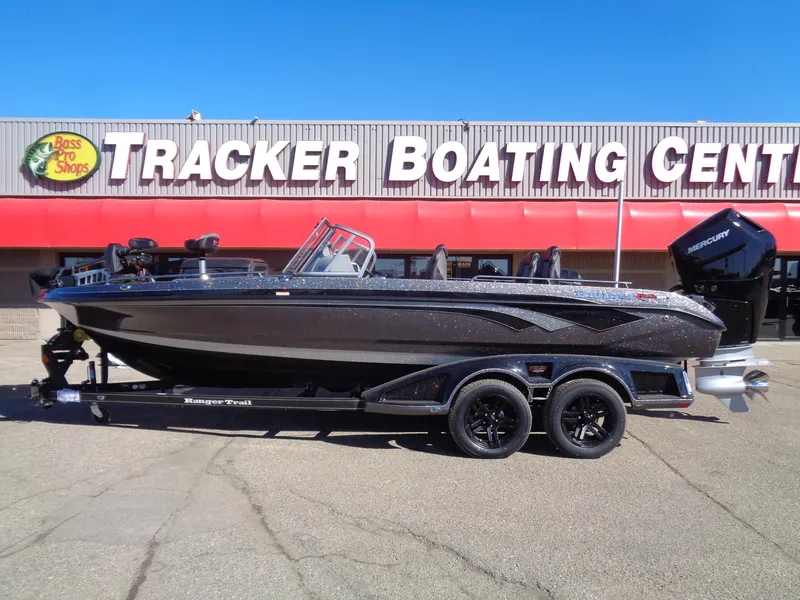 Slide: The Image of 2025 Ranger 621FS Pro boat at Tracker Boating Center, parked on a trailer. - 0