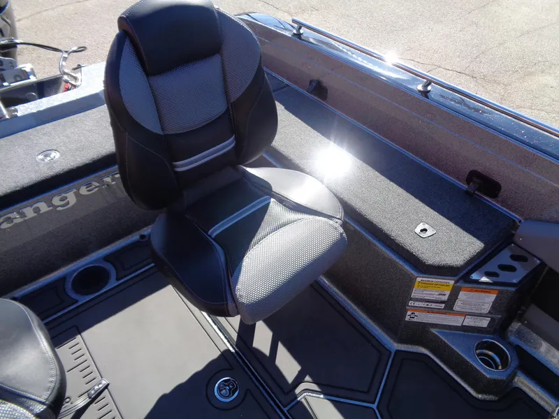 Slide: The Image of 2025 Ranger 621FS Pro boat interior with cushioned seat and storage compartments. - 10