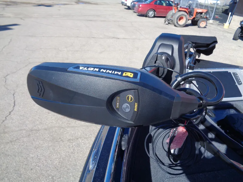 Slide: The Image of 2025 Ranger 621FS Pro with Minn Kota motor in a parking lot. - 15