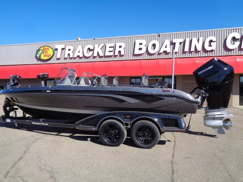 Slide: The Image of 2025 Ranger 621FS Pro boat at Tracker Boating Center, featuring sleek design and powerful Mercury engine. - 2
