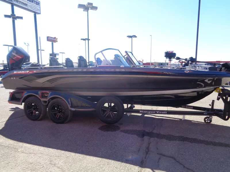 Slide: The Image of 2025 Ranger 621FS Pro boat on trailer, sleek design, parked outdoors. - 5