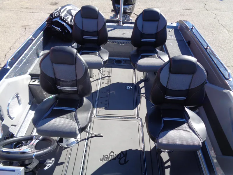 Slide: The Image of 2025 Ranger 621FS Pro boat interior with five black and gray seats. - 7