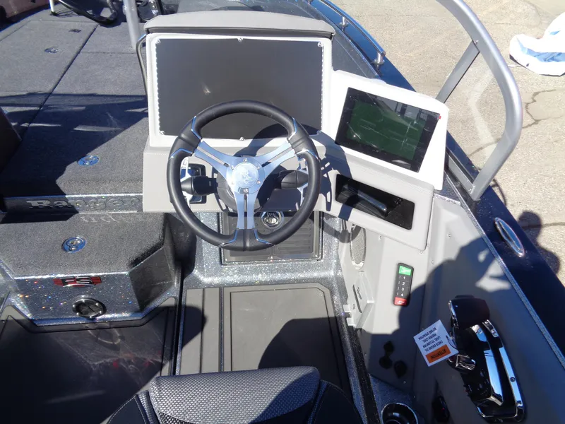 Slide: The Image of 2025 Ranger 621FS Pro boat cockpit with steering wheel and modern control panel. - 8