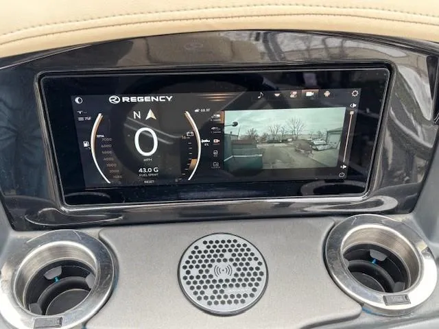 Slide: The Image of 2024 Regency 250 LE3 dashboard with digital display and navigation system. - 26