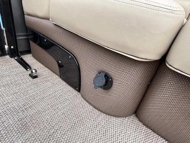 Slide: The Image of 2024 Regency 250 LE3 interior detail with beige seating and textured flooring. - 39