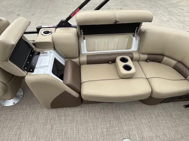 Slide: The Image of 2024 Regency 250 LE3 boat interior with beige seating and cup holders. - 41