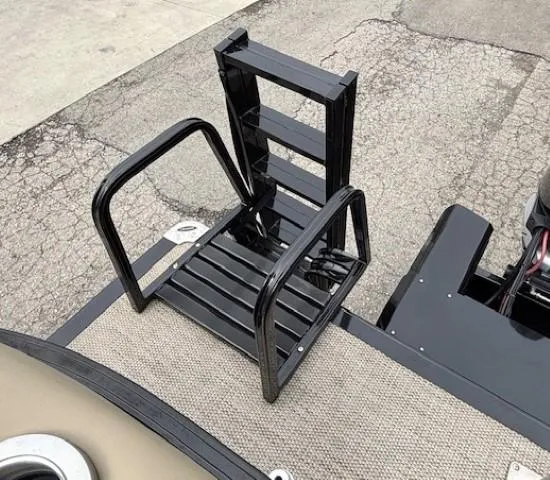 Slide: The Image of 2024 Regency 250 LE3 boat with a black metal boarding ladder on deck. - 45