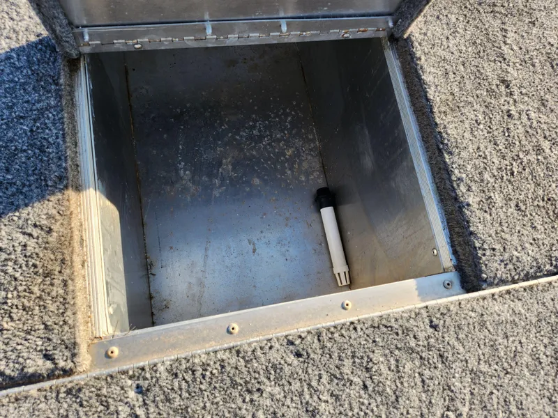 Slide: The Image of Open storage compartment in 2021 Tracker Pro 170 boat, showing interior space. - 16