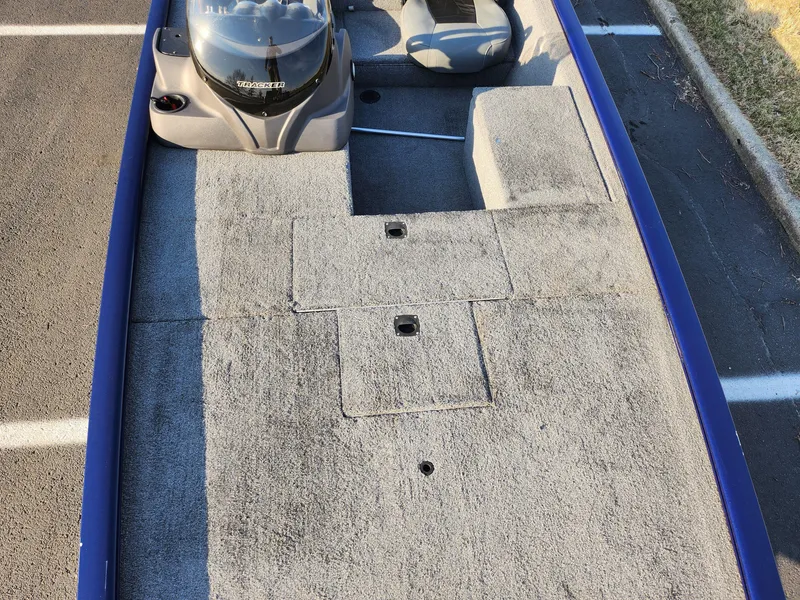 Slide: The Image of 2021 Tracker Pro 170 boat interior with gray carpet and seating. - 18