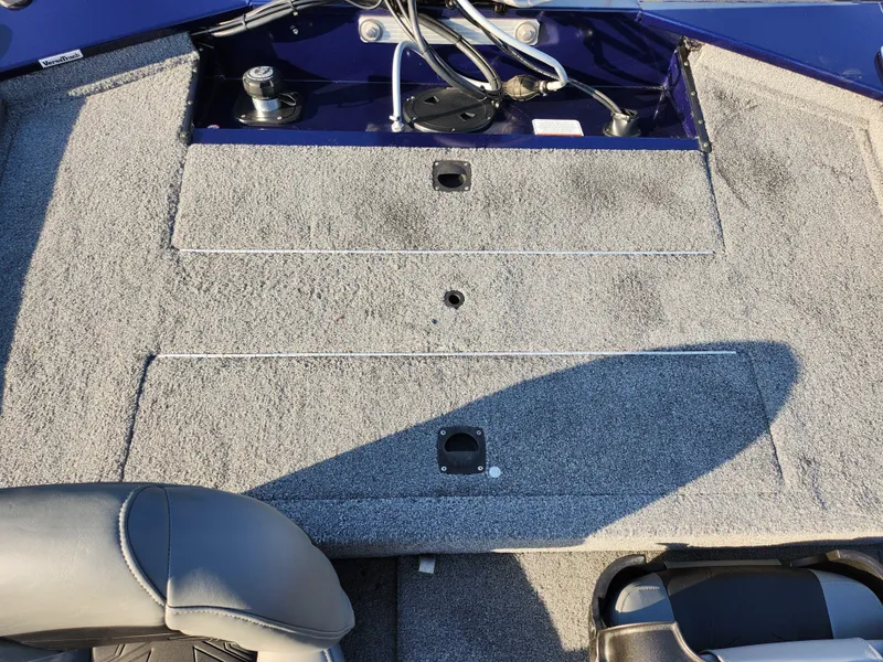 Slide: The Image of 2021 Tracker Pro 170 boat interior with gray carpet and seating. - 22