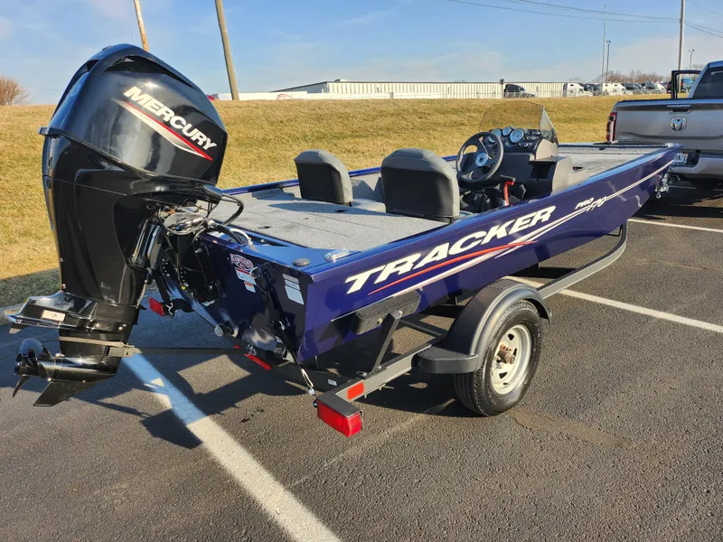 Slide: The Image of 2021 Tracker Pro 170 boat with Mercury engine on trailer in parking lot. - 3