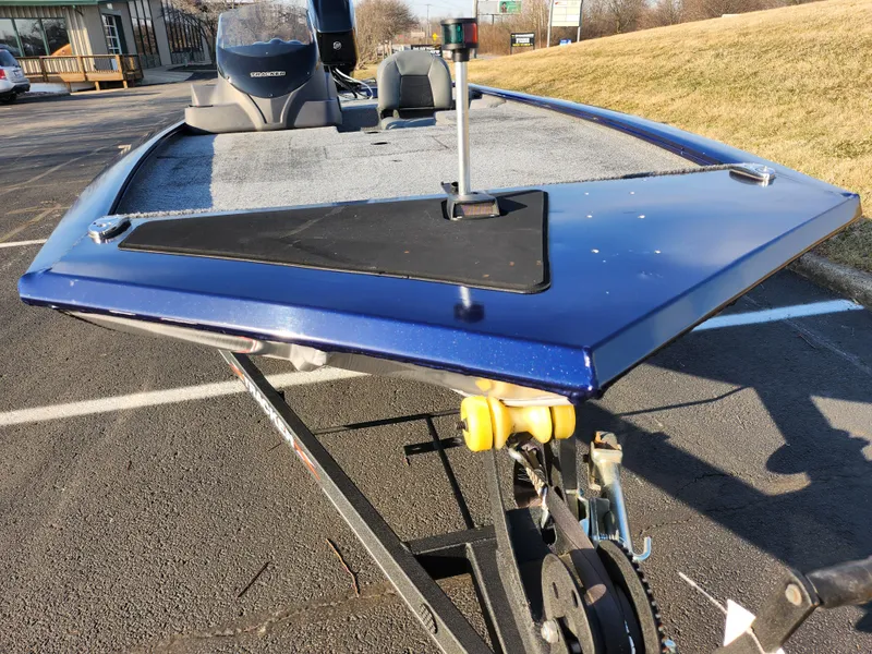 Slide: The Image of 2021 Tracker Pro 170 boat on trailer, blue exterior, parked outdoors. - 6