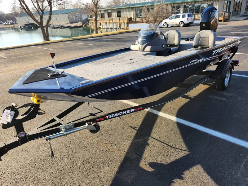 Slide: The Image of 2021 Tracker Pro 170 boat on trailer, parked near waterfront. - 8