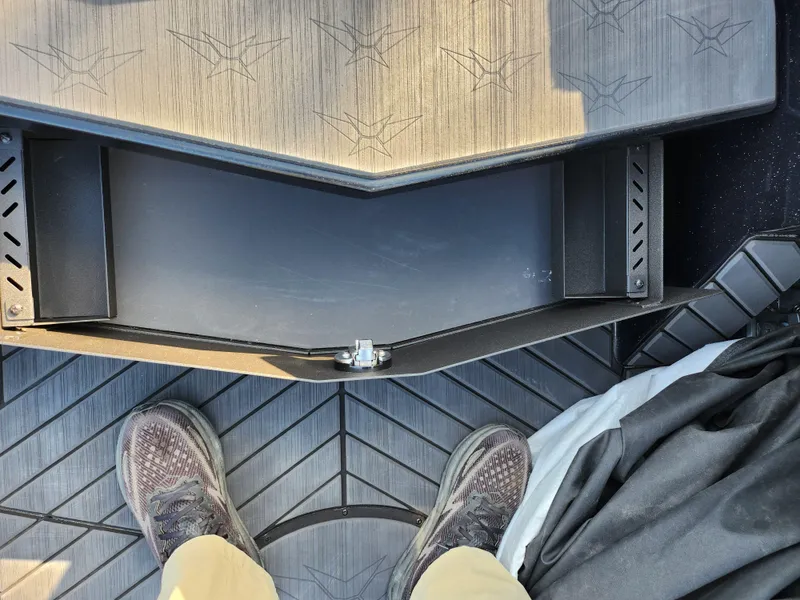 Slide: The Image of 2023 Vexus VX20 boat interior with open storage compartment and textured flooring. - 15