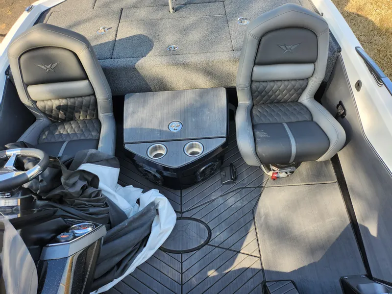 Slide: The Image of 2023 Vexus VX20 boat interior with two seats and a center console. - 20