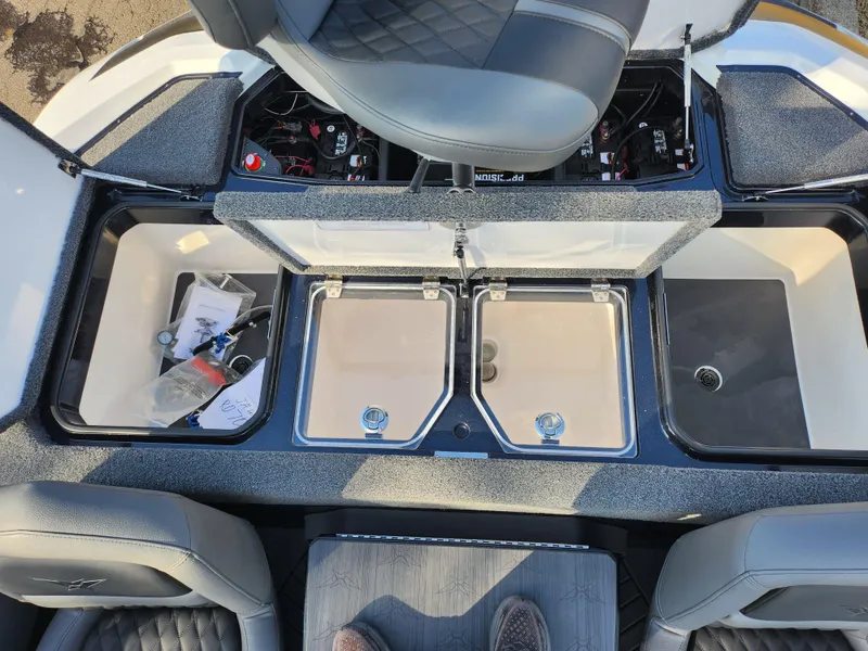 Slide: The Image of 2023 Vexus VX20 boat interior with open storage compartments and seating. - 24