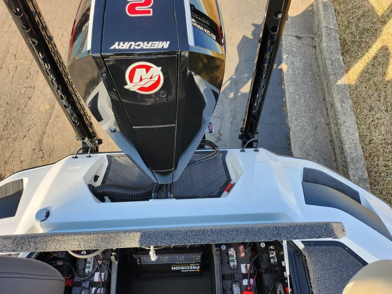 Slide: The Image of 2023 Vexus VX20 boat with Mercury engine, showcasing rear deck and battery compartment. - 26