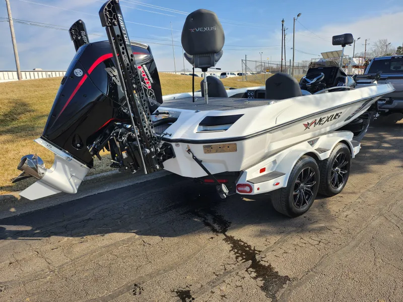 Slide: The Image of 2023 Vexus VX20 boat on trailer, rear view, showcasing powerful outboard motor. - 3