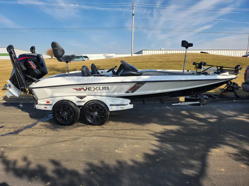 Slide: The Image of 2023 Vexus VX20 boat on trailer, side view, parked outdoors. - 4