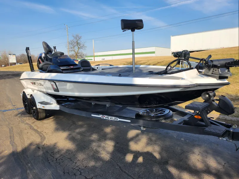 Slide: The Image of 2023 Vexus VX20 boat on trailer, parked outdoors, showcasing sleek design and modern features. - 5