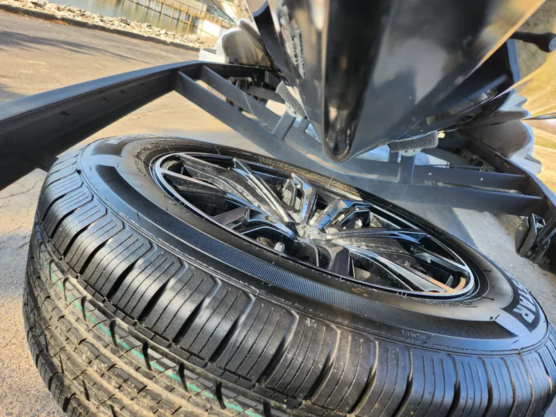 Slide: The Image of Close-up of a 2023 Vexus VX20 trailer tire and wheel on a sunny day. - 7