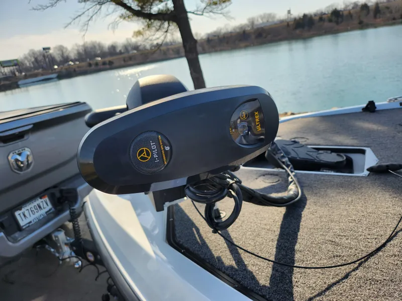 Slide: The Image of 2023 Vexus VX20 boat with advanced trolling motor by a lakeside. - 9