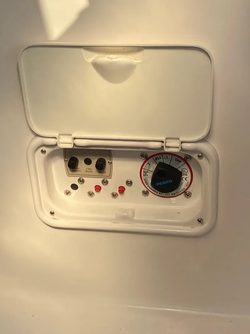 Slide: The Image of 2009 Regal 2400 Bowrider control panel with gauges and switches. - 10