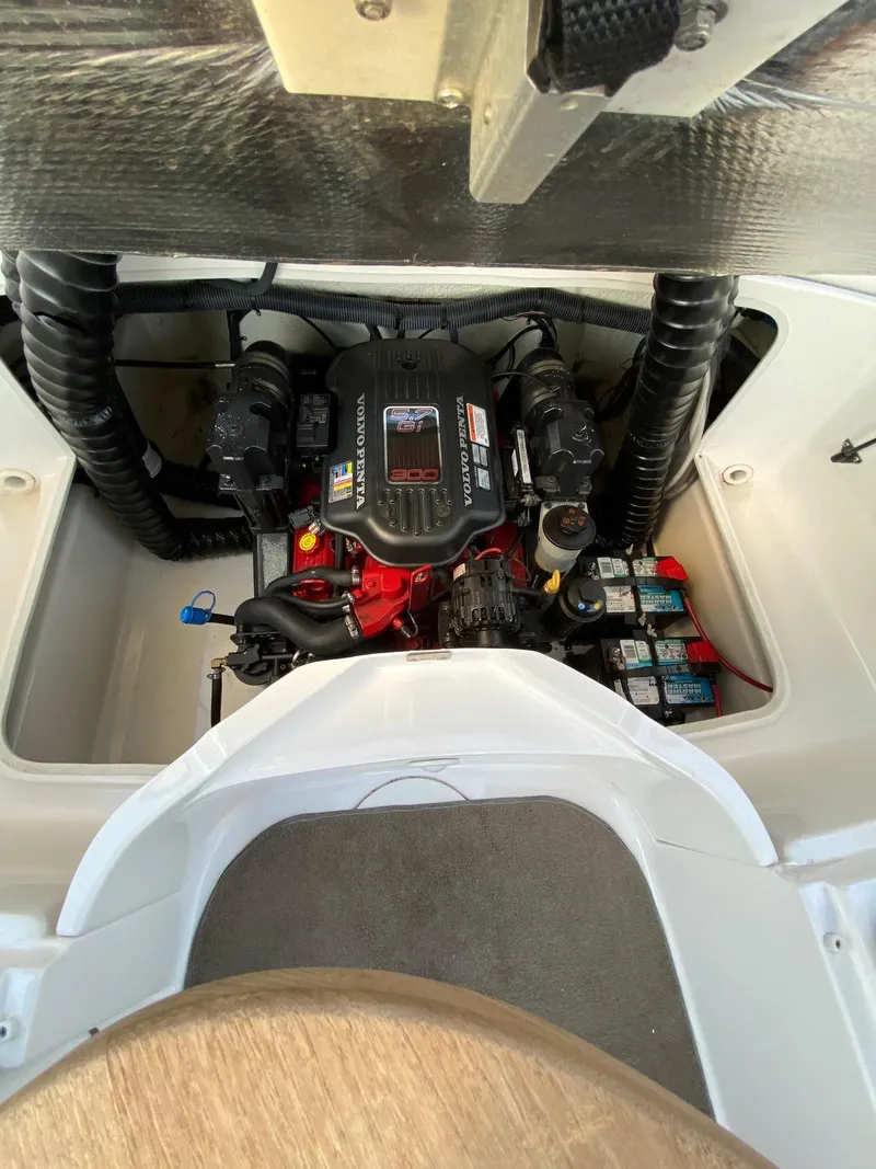 Slide: The Image of 2009 Regal 2400 Bowrider engine compartment with visible components and wiring. - 14