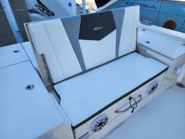 Slide: The Image of 2023 Robalo 266 Cayman boat interior with white seating and sleek design. - 10