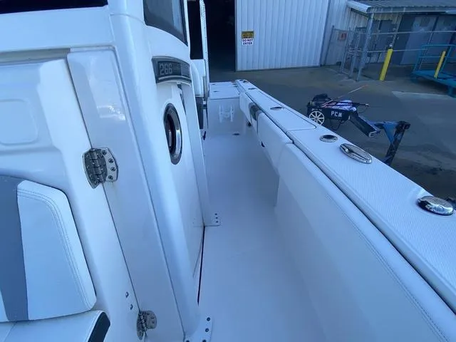 Slide: The Image of 2023 Robalo 266 Cayman boat interior with a mounted speaker. - 20