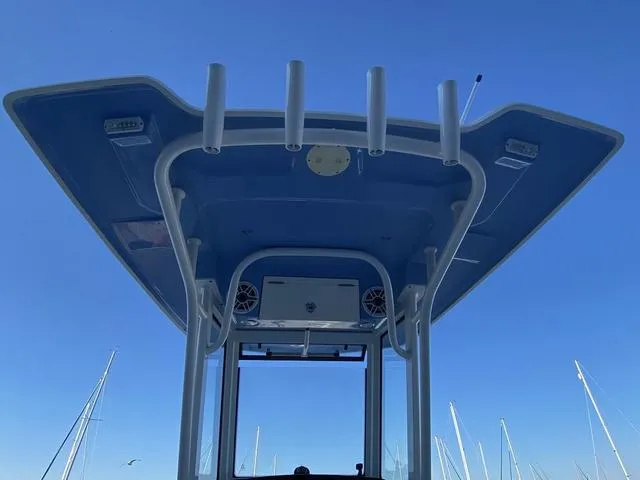 Slide: The Image of 2023 Robalo 266 Cayman boat deck with storage and measurement scale. - 26