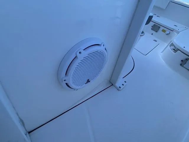 Slide: The Image of 2023 Robalo 266 Cayman boat engine and hydraulic system close-up. - 28