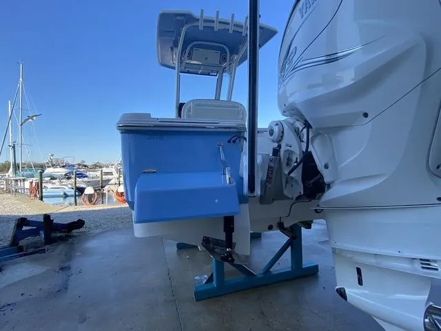 Slide: The Image of 2023 Robalo 266 Cayman boat detail with motor mount and deck view. - 34