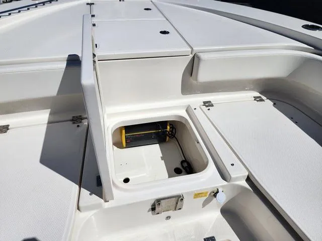 Slide: The Image of 2023 Robalo 266 Cayman boat with Yamaha outboard motor in marina setting. - 39