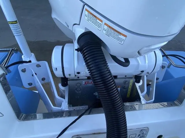 Slide: The Image of 2023 Robalo 266 Cayman boat motor detail with hydraulic components. - 44