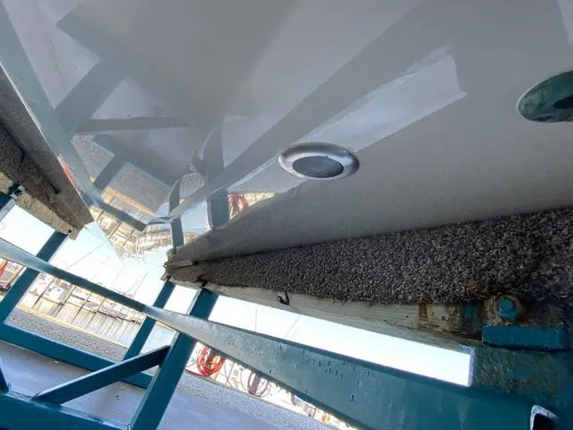 Slide: The Image of 2023 Robalo 266 Cayman boat hull on trailer, close-up view. - 46