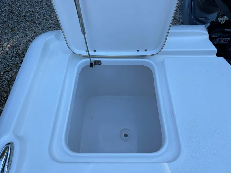 Slide: The Image of Open storage compartment on 2020 Tidewater 2500 Carolina Bay boat. - 12
