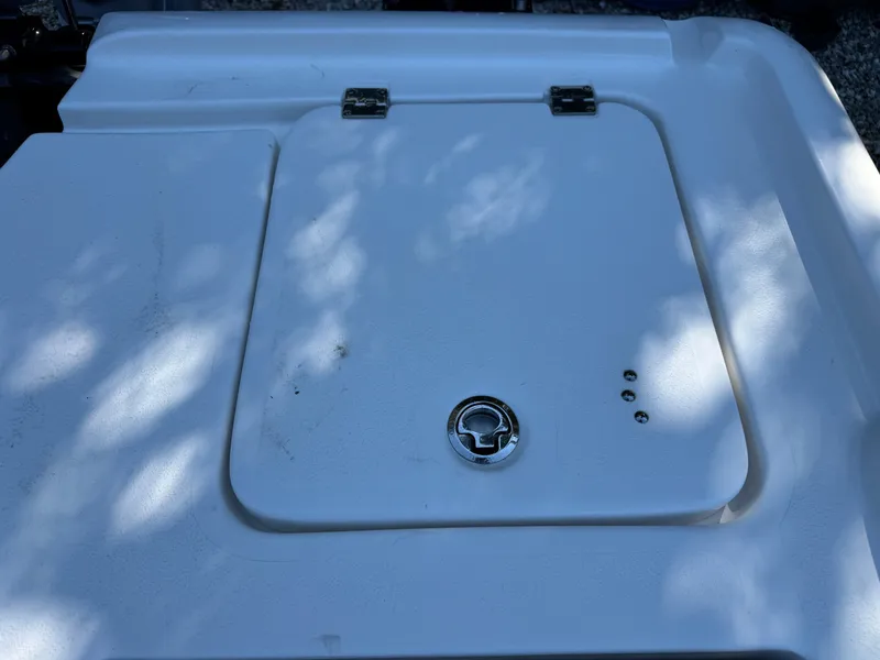 Slide: The Image of Hatch cover on 2020 Tidewater 2500 Carolina Bay boat, featuring a secure latch. - 16