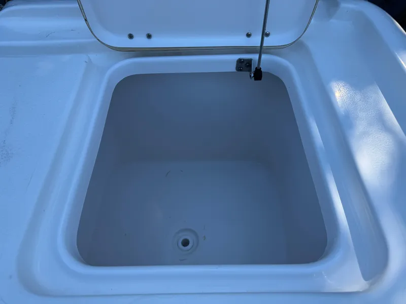 Slide: The Image of Open storage compartment on 2020 Tidewater 2500 Carolina Bay boat. - 17