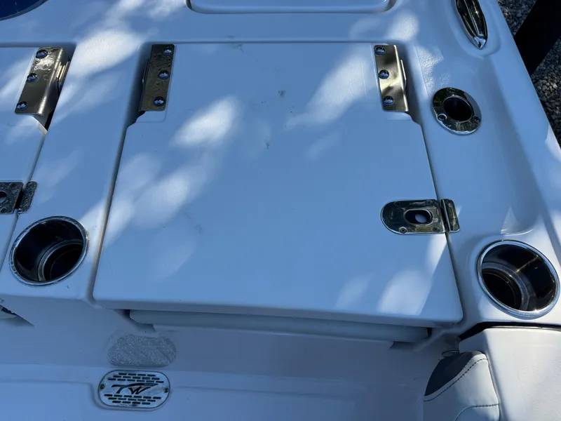 Slide: The Image of 2020 Tidewater 2500 Carolina Bay boat deck with cup holders and storage compartments. - 18