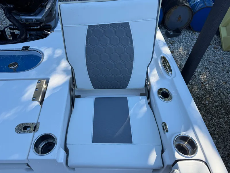 Slide: The Image of Tidewater 2500 Carolina Bay 2020 boat seat with cup holders and storage compartments. - 19