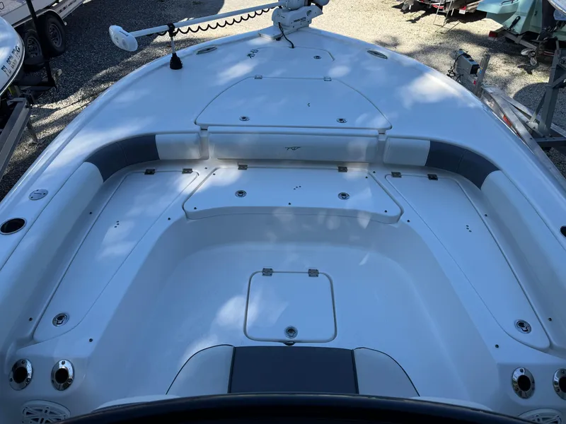 Slide: The Image of 2020 Tidewater 2500 Carolina Bay boat deck with seating and storage compartments. - 22