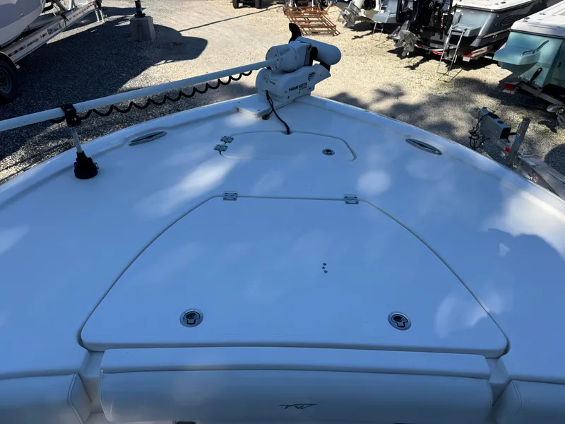 Slide: The Image of 2020 Tidewater 2500 Carolina Bay boat deck with trolling motor, parked outdoors. - 23