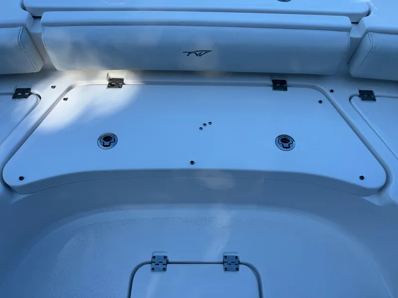 Slide: The Image of 2020 Tidewater 2500 Carolina Bay boat deck with storage compartment. - 27